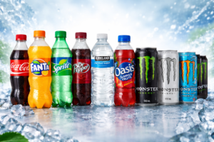 Assorted 500ml soft drinks and energy drinks including Coca‑Cola, Fanta, Sprite, Dr Pepper, Oasis, Monster Energy and Kirkland purified water – wholesale beverages for restaurants and takeaways.