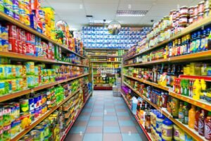 Large food wholesale warehouse with stacked pallets and shelves supplying bulk food products for restaurants and catering businesses in the UK