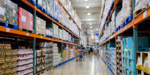 Large wholesale food warehouse with bulk grocery products and storage racks in Coventry UK