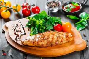 Grilled chicken fillet with fresh salad and tomatoes